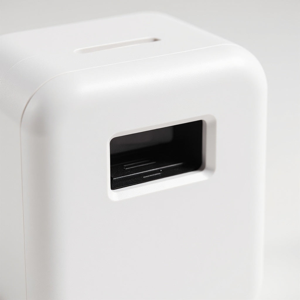 Instant inkless Zink photo print emerging from output slot with crisp colors